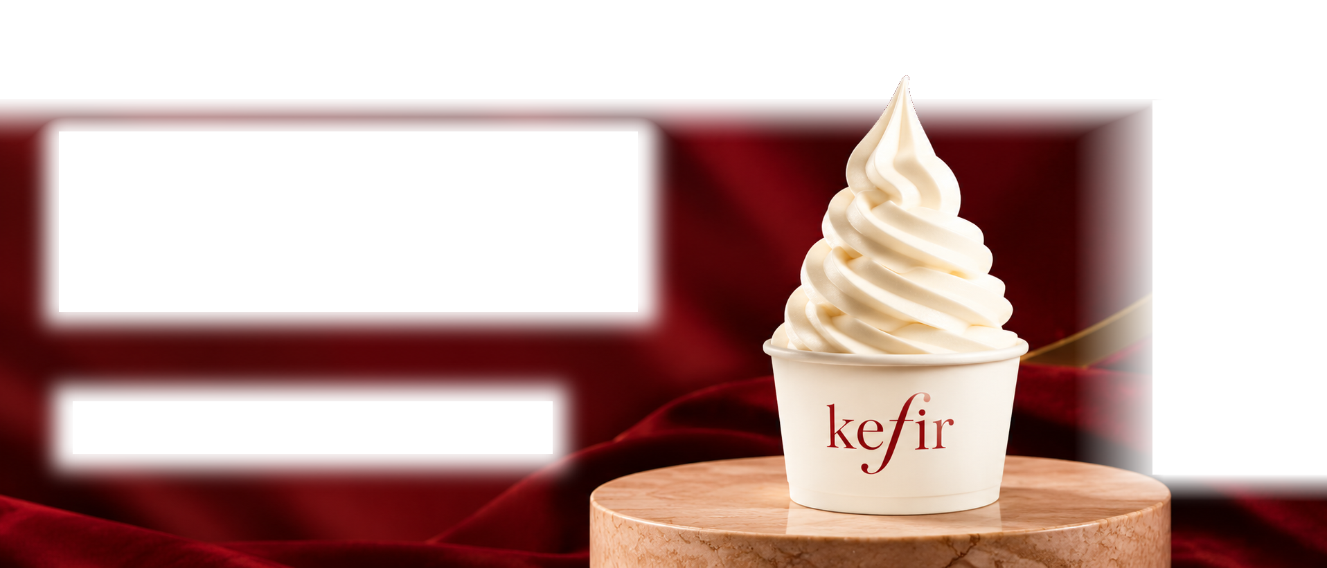 Plain Kefir soft-serve in its original branded cup, on a marble pedestal surrounded by burgundy fabric